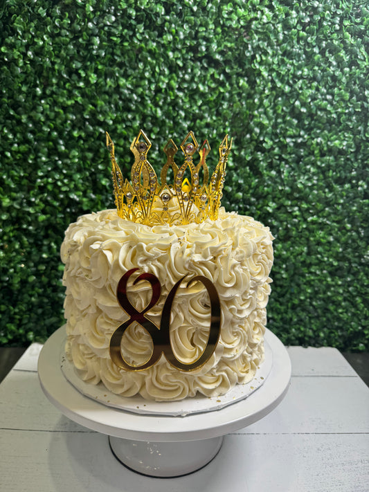 Best white rosette cake with gold crown, number 80, and custom message in Oxford, MS